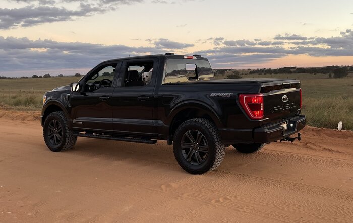 35” KO2 tires on stock wheels + 2" inch level. No crash bar cutting needed